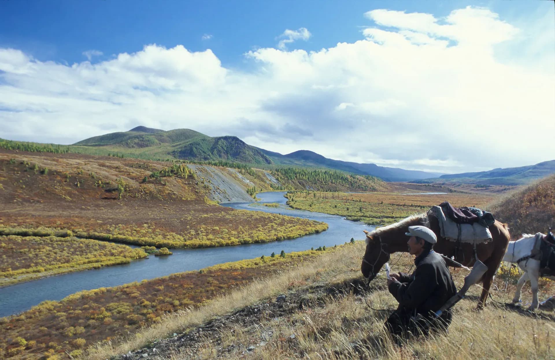 Horseman resting by the river valley