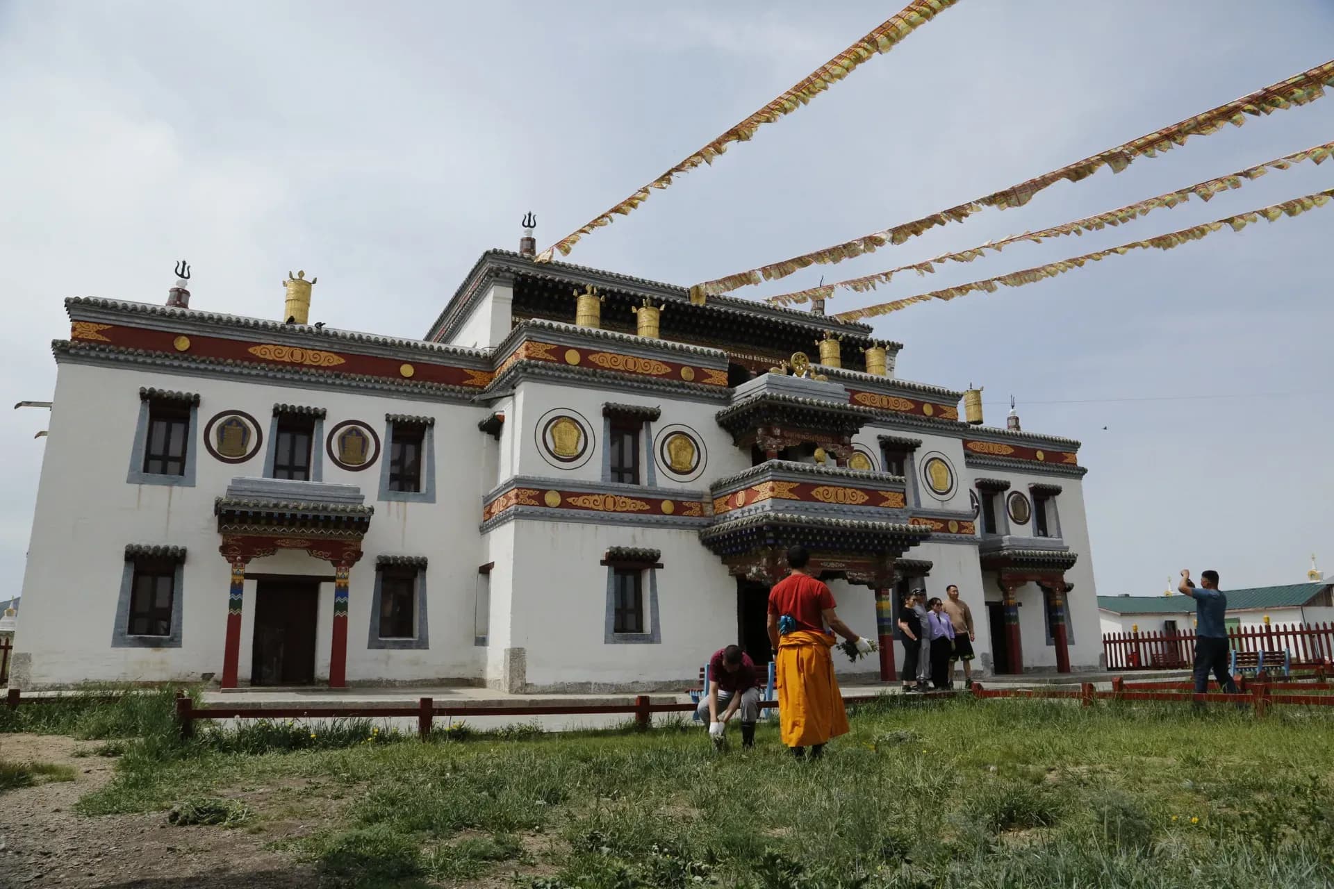 Buddhist monastery entrance with monk