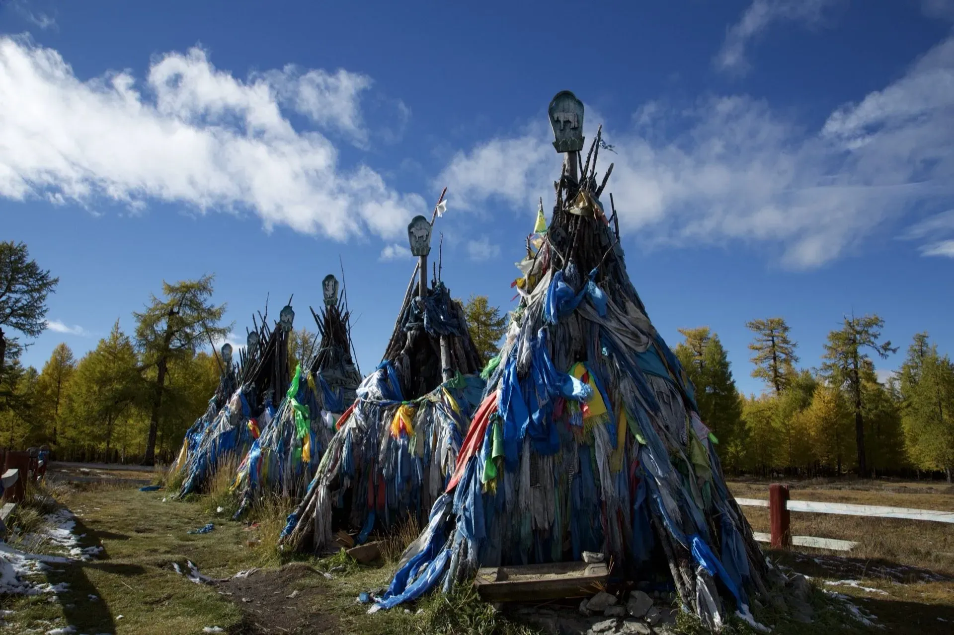 Shamanic ovoo with prayer flags